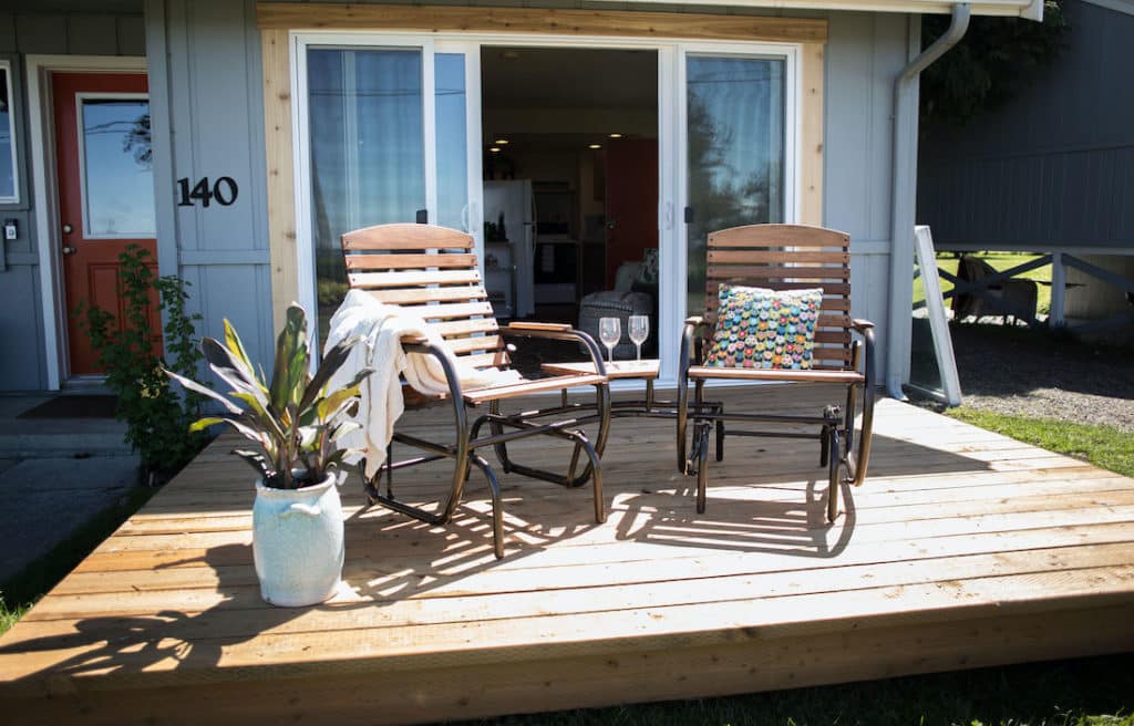 things to do in Sequim, photo of the Dungeness Bay Cottages, two chairs looking out to the beautiful view